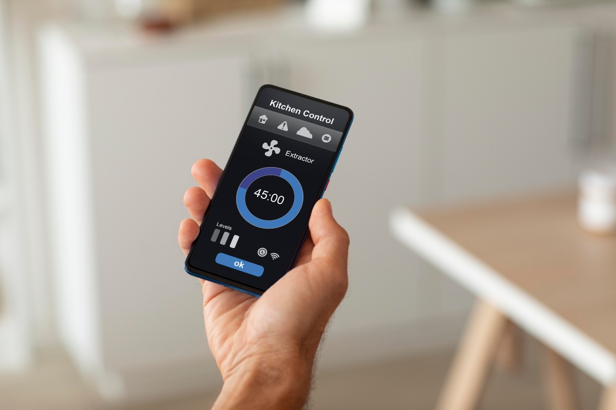 Person controlling home automation system through smartphone app