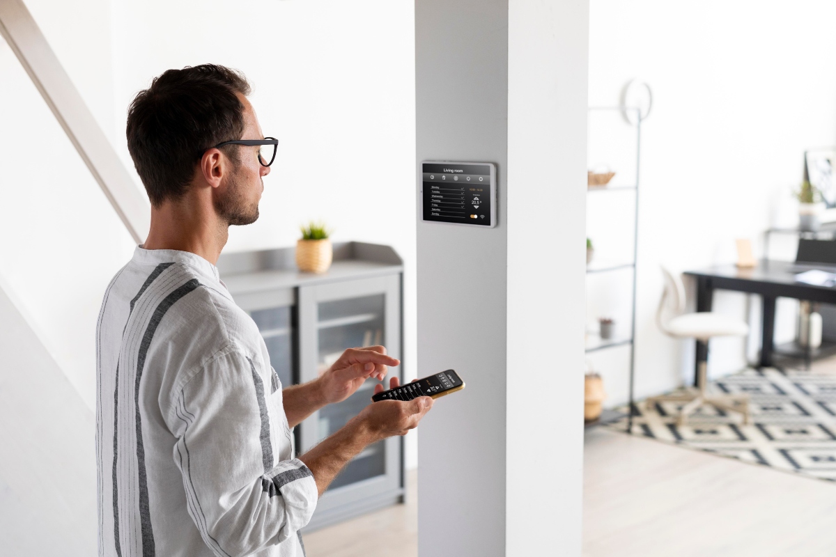 Man using phone to control smart home system