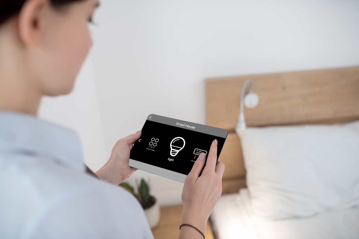 Woman controlling her smart home system
